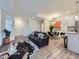 Spacious living room offering an open layout, dining space, and kitchen with modern appliances at 12920 Jasmine St # F, Thornton, CO 80602