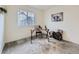 Home office with a large window providing natural light and stylish decor at 12920 Jasmine St # F, Thornton, CO 80602