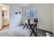 Well-lit home office space with modern desk and chair, ideal for remote work at 12920 Jasmine St # F, Thornton, CO 80602