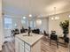 Inviting open-concept floor plan with a combined living, dining, and kitchen area for modern living at 12920 Jasmine St # F, Thornton, CO 80602
