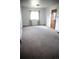 Bright bedroom with neutral carpet and a large window at 2902 Depew St, Wheat Ridge, CO 80214