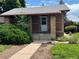 Inviting brick home featuring a front door framed by charming brick pillars at 2902 Depew St, Wheat Ridge, CO 80214