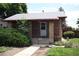 Charming brick home featuring a well-maintained front yard and covered entryway at 2902 Depew St, Wheat Ridge, CO 80214