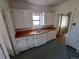 Bright kitchen featuring ample storage and wood countertops at 2902 Depew St, Wheat Ridge, CO 80214