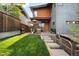 Backyard with outdoor kitchen, stainless steel grill, and outdoor seating at 5134 Quitman St, Denver, CO 80212