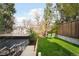 Backyard with a sloped lawn, stairs, and green lounge chairs at 5134 Quitman St, Denver, CO 80212