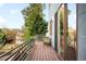 Relaxing outdoor balcony with seating area, wood flooring and views of the surrounding neighborhood at 5134 Quitman St, Denver, CO 80212
