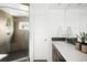 Modern bathroom featuring a glass shower, sleek vanity, and stylish fixtures at 5134 Quitman St, Denver, CO 80212