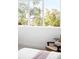 Bright bedroom featuring a large window with a view of lush greenery at 5134 Quitman St, Denver, CO 80212
