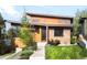 Contemporary home featuring a unique design with mixed materials and a well-manicured front yard and inviting front entrance at 5134 Quitman St, Denver, CO 80212