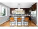 Modern kitchen features a central island with bar seating, state-of-the-art appliances, and ample counter space at 5134 Quitman St, Denver, CO 80212