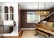 Chic living room with modern lighting, hardwood floors, and beautiful piano at 5134 Quitman St, Denver, CO 80212