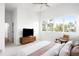 Bright and spacious main bedroom with large windows providing natural light and city views at 5134 Quitman St, Denver, CO 80212