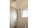 Modern bathroom with glass enclosed shower, sleek fixtures, and neutral tile at 5134 Quitman St, Denver, CO 80212