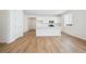 Bright kitchen features modern, white cabinets and a kitchen island with a sink at 45933 Wood Thrush Ave, Bennett, CO 80102