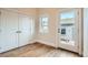 Bedroom featuring hardwood floors, closet, and lots of natural light at 1909 S Logan St, Denver, CO 80210