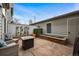 Backyard patio featuring red brick pavers, a built in brick planter box, and outdoor seating at 479 Josephine St, Denver, CO 80206