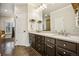 Elegant bathroom with marble countertops, dark wood cabinets, and tile floors at 479 Josephine St, Denver, CO 80206