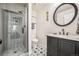 Bathroom featuring a stand up shower with glass doors and granite countertop on the vanity sink at 479 Josephine St, Denver, CO 80206