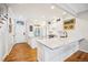 Bright, all-white kitchen with hardwood floors and marble countertops at 479 Josephine St, Denver, CO 80206