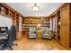 Spacious library with wooden bookshelves, hardwood floors, and leather chairs at 479 Josephine St, Denver, CO 80206