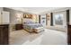 Bright primary bedroom with large windows, neutral carpet and stylish furniture at 479 Josephine St, Denver, CO 80206