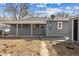 Exterior view of home's backyard and detached garage at 1227 Yost St, Aurora, CO 80011