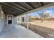 Spacious covered patio leading to a detached garage and backyard at 1227 Yost St, Aurora, CO 80011