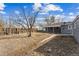 Backyard showing a fenced perimeter and ample room for outdoor activities at 1227 Yost St, Aurora, CO 80011