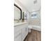 Stylish bathroom with updated fixtures, geometric tile, and a modern vanity at 1227 Yost St, Aurora, CO 80011