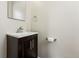 Contemporary bathroom featuring a modern vanity, sleek mirror, and stylish fixtures at 1227 Yost St, Aurora, CO 80011