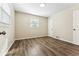 The bedroom is well-lit with vinyl floors and a window at 1227 Yost St, Aurora, CO 80011