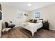 Inviting bedroom featuring a comfortable bed, stylish decor, and ample natural light at 1227 Yost St, Aurora, CO 80011