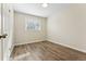 Bedroom with vinyl floors with large window providing lots of light at 1227 Yost St, Aurora, CO 80011