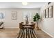 Inviting dining room with modern decor, a stylish table setting, and plenty of natural light at 1227 Yost St, Aurora, CO 80011