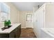 Well-lit laundry room featuring custom cabinets, modern countertops, and new washer and dryer at 1227 Yost St, Aurora, CO 80011