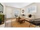 Inviting living room with a comfortable sofa, stylish decor, and warm natural light streaming through the windows at 1227 Yost St, Aurora, CO 80011