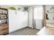 Well-lit bedroom featuring a murphy bed and ample storage at 4612 S Coors Ct, Morrison, CO 80465