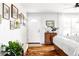 Bright entryway with hardwood floors, white door, and gallery wall at 4612 S Coors Ct, Morrison, CO 80465