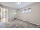 Bedroom featuring soft carpeting, a window and mirrored closet doors at 951 Tennyson St, Denver, CO 80204