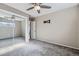 Carpeted bedroom with ceiling fan, mirrored closet doors, and TV mount at 951 Tennyson St, Denver, CO 80204