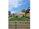 Quaint home featuring a manicured lawn and privacy fence at 951 Tennyson St, Denver, CO 80204