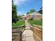 Charming home with a well-manicured lawn and inviting walkway to the front door at 951 Tennyson St, Denver, CO 80204