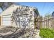 Spacious two-car garage with white doors, perfect for parking and additional storage at 951 Tennyson St, Denver, CO 80204