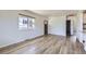 Bright living room featuring light wood flooring and ample natural light at 951 Tennyson St, Denver, CO 80204