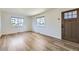 Inviting living room with light wood flooring and natural light from the windows at 951 Tennyson St, Denver, CO 80204
