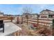 Landscaped front yard with a decorative fence, and drought-tolerant plants for curb appeal at 692 Sage Forest Ln, Monument, CO 80132