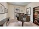 Music room featuring a baby grand piano, built-in shelving, and natural light at 692 Sage Forest Ln, Monument, CO 80132