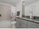 Modern bathroom with granite countertops and shower-tub combo at 1700 Bassett St # 1612, Denver, CO 80202