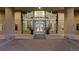 Grand entrance to a building, featuring a glass facade and decorative plants at 1700 Bassett St # 1612, Denver, CO 80202